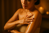 video of lady rubbing body oil into her skin